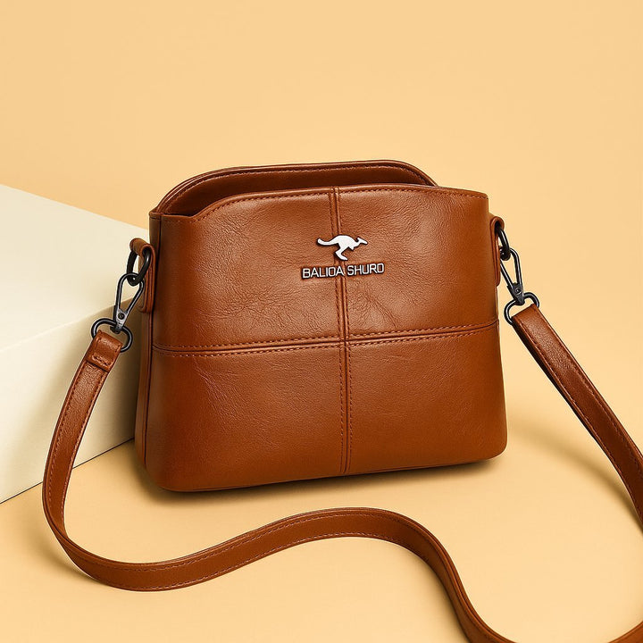 Women's Faux Leather Paneled Zip-Top Adjustable Crossbody Bag - Brown