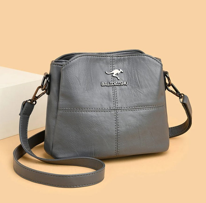 Women's Faux Leather Paneled Zip-Top Adjustable Crossbody Bag - Grey